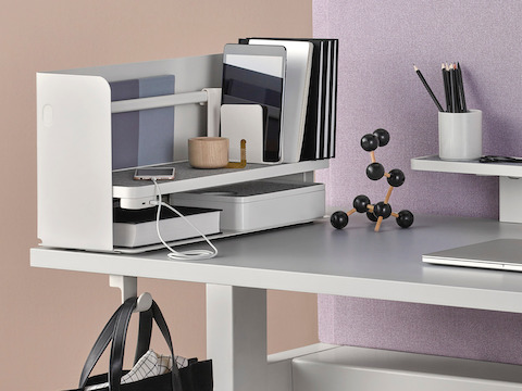 Various Ubi Work Tools situated on a desktop to support office organization. Select to go to our desk accessories pages.