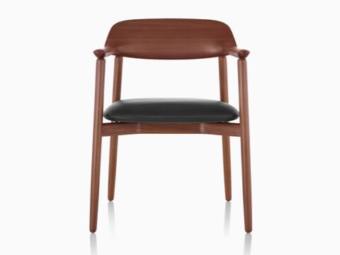 La mitad superior de una silla lateral Crosshatch con un acabado oscuro y cojín de asiento negro, visto desde el frente. La mitad superior de una silla lateral Crosshatch con un acabado oscuro y cojín de asiento negro, visto desde el frente.