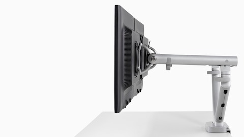 Vista de perfil de monitores uno al lado del otro unidos a un brazo de monitor Flo Dual. Vista de perfil de monitores uno al lado del otro unidos a un brazo de monitor Flo Dual.